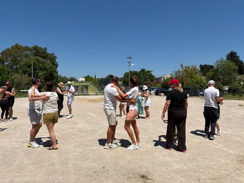 Salsa class: couples dancing on the open-air grounds